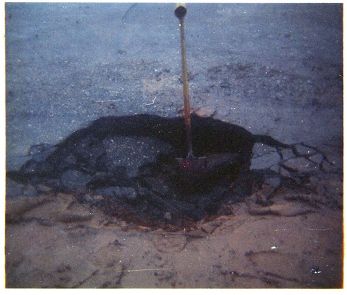 Color photo of rock slide in maintenance yard.