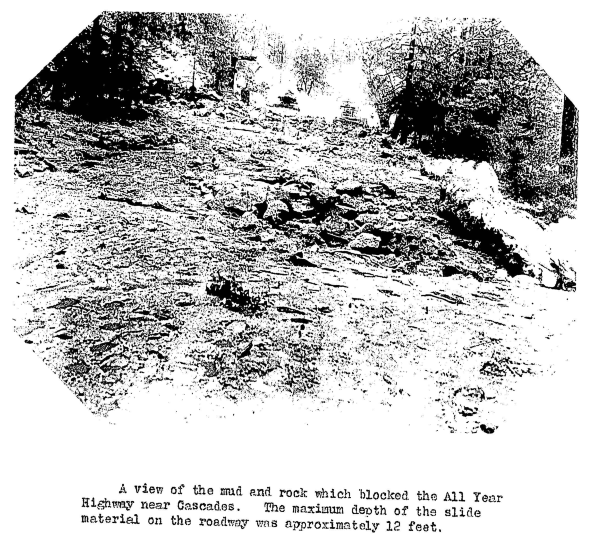 Mud and rock blocking road.