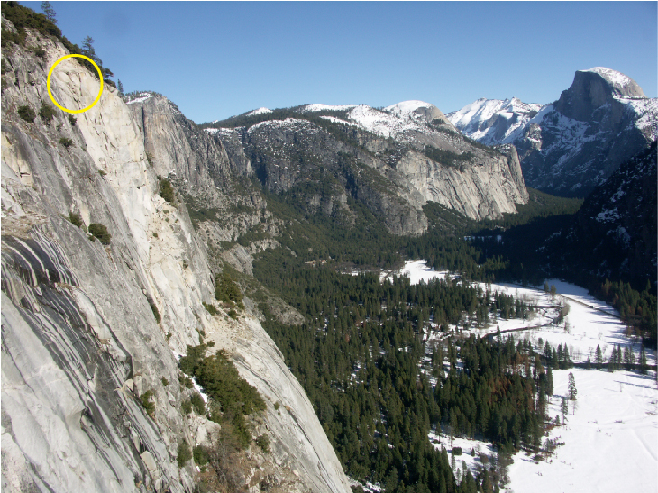 An oblique perspective of a rock fall source area on a steep cliff face, circled in yellow.