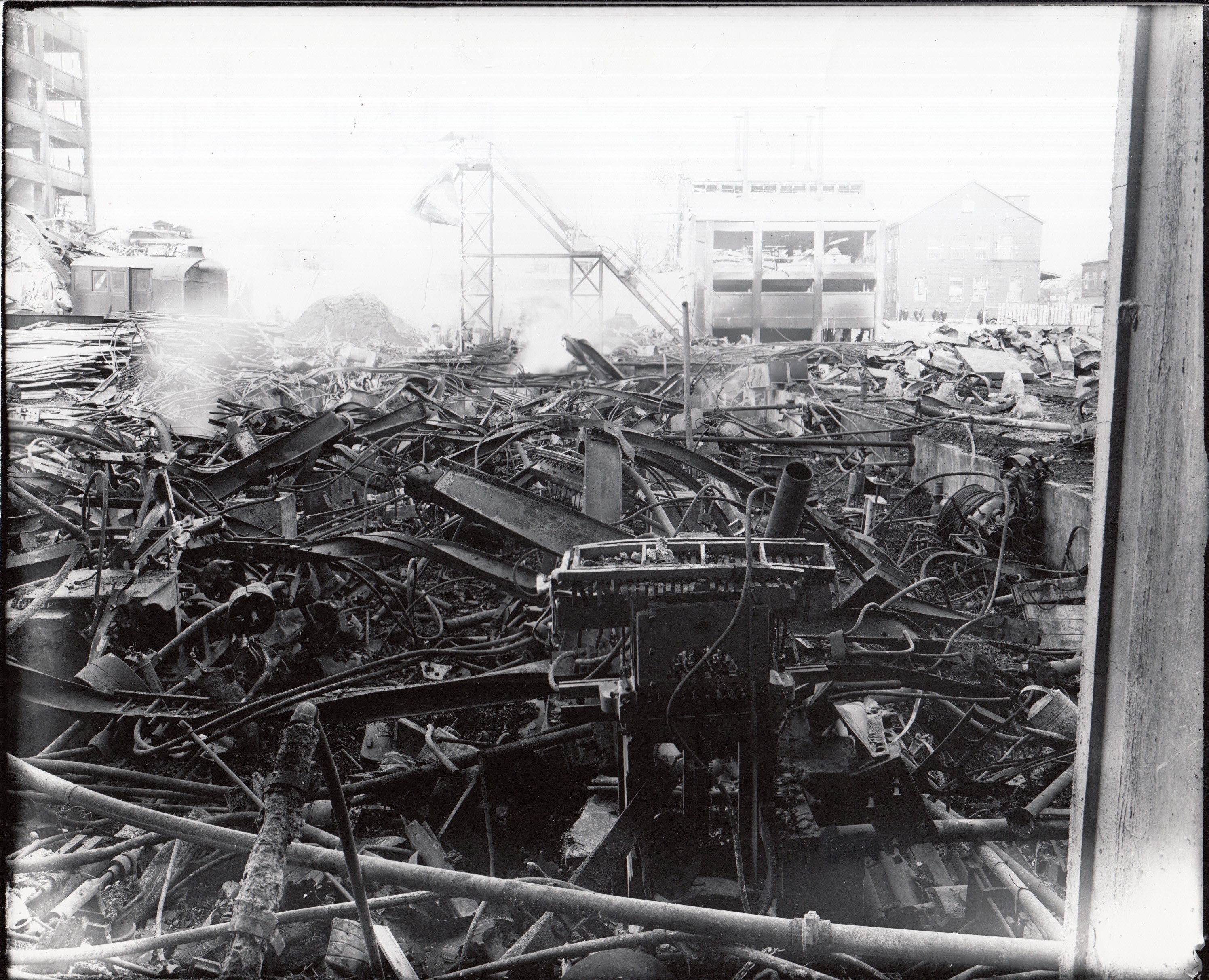 Remains of Building 18 with twisted metal in foreground.