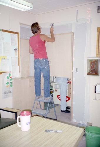 Man working on the construction of headquarters addition.