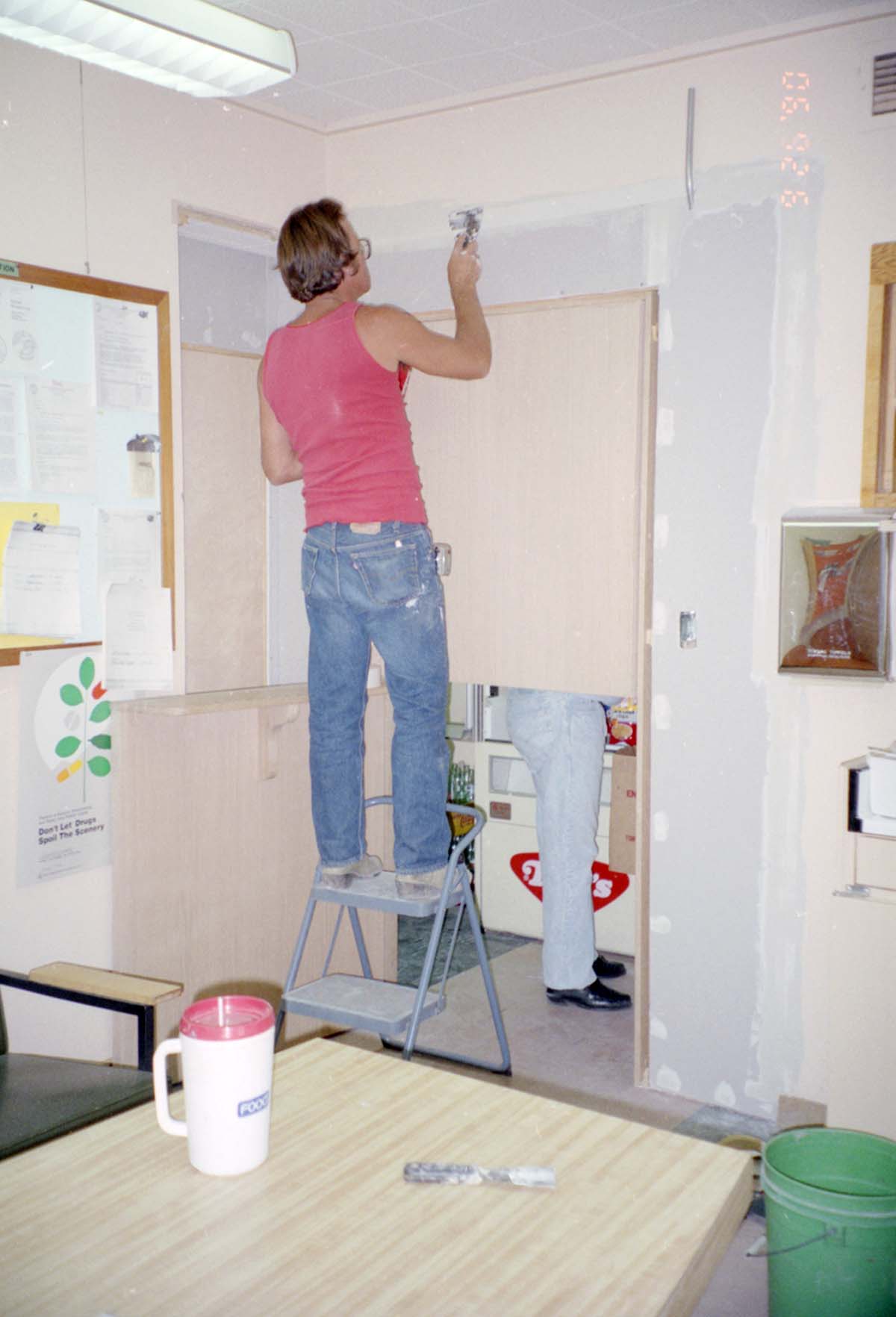 Man working on the construction of headquarters addition.