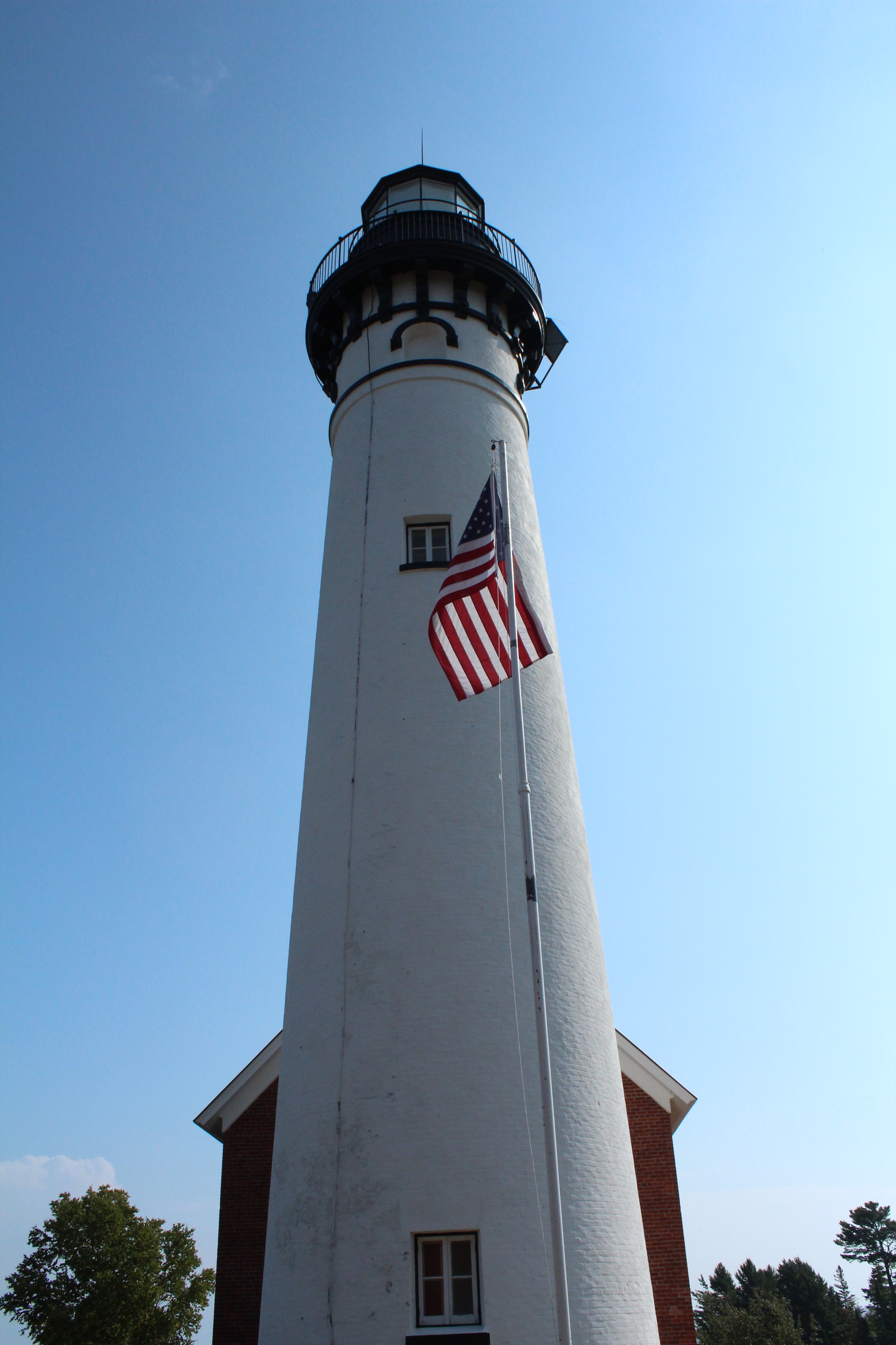 Au Sable Lighthouse. The light tower's base diameter is 16 feet and the tower reaches a height of 87 feet. 
