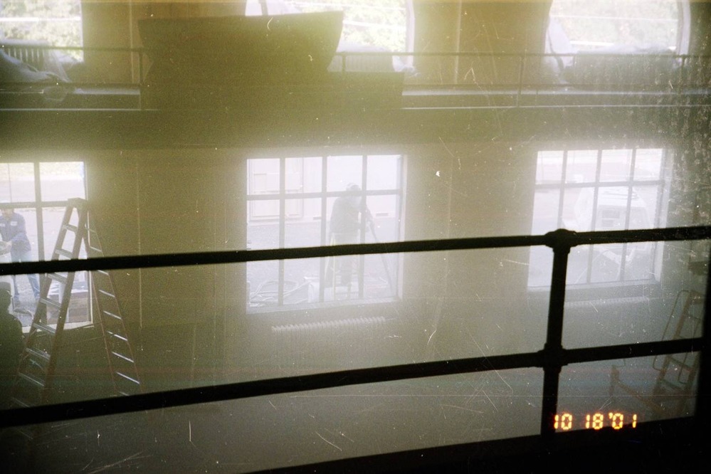 The auditorium window frames are being painted.