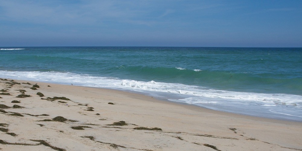 Yellow sands and blue waters of a beach at Cape Hatteras National Seashore
