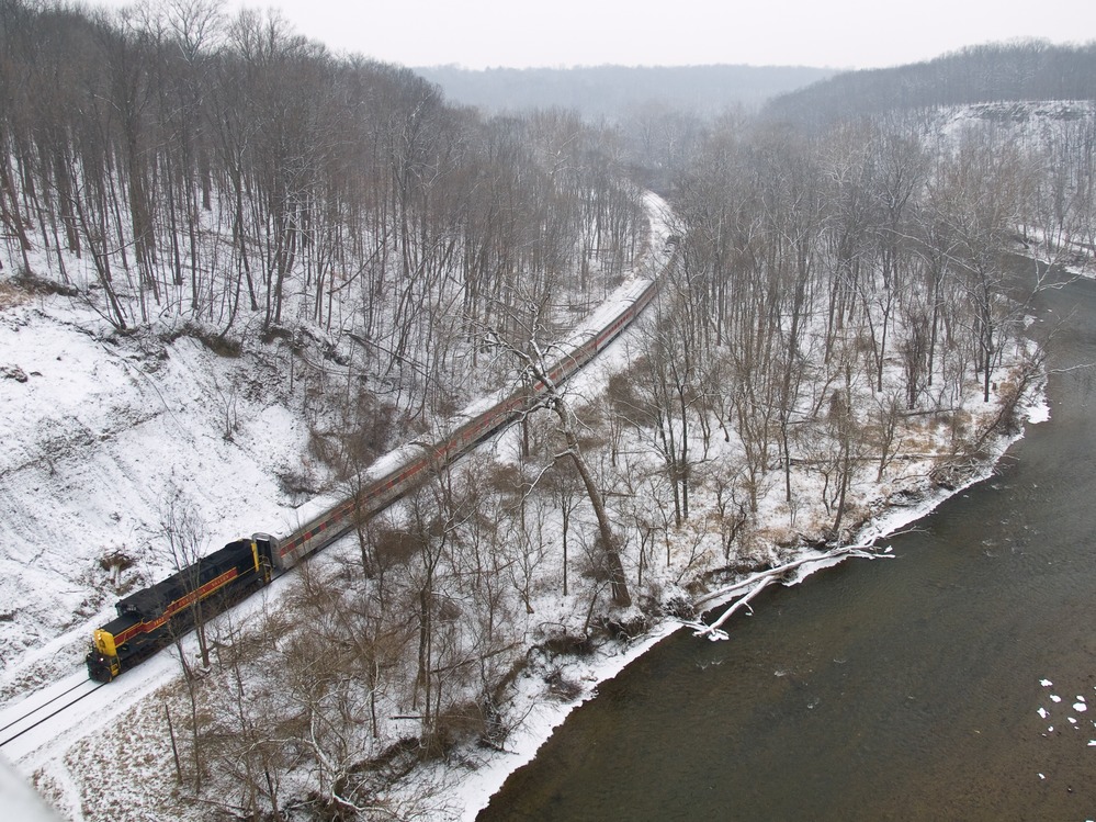 The Cuyahoga Valley Scenic Railroad (CVSR) train runs along the Cuyahoga River during the Winter.