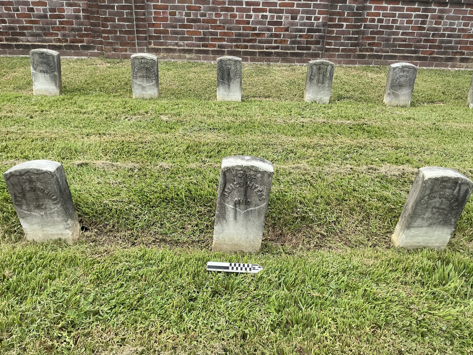 Extra image of historic upright marble headstone with recessed shield face.
