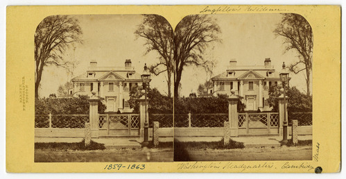 Black and white sterograph of facade of Georgian mansion, with writing around photographs.