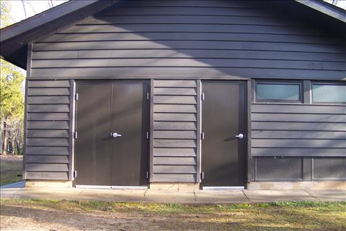 Paint and stain exterior of historic structures in camp 3 and camp 5 at Prince William Forest Park April 2012.