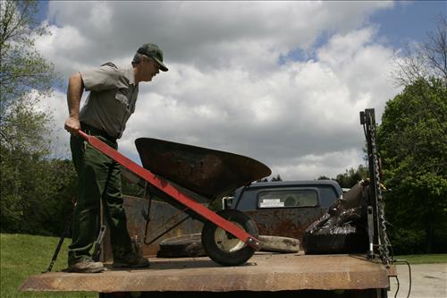 RiverDay trash clean up staff and volunteers at dumpster