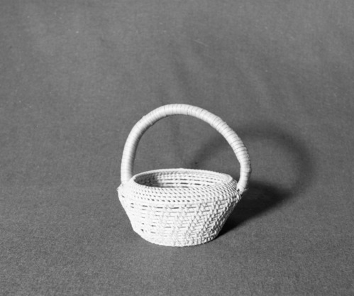 Marie Rozier Collection, Catalog No. 2A-3. Object: Samoan or Tongan basket. Dimensions: 7 1/2". Materials: Made of palm rib or pandanus leaves. Collection History: Alice Reade Collection. Photographed by Michael Dixon, December 1982. Catalogued by Craig Bates and Barbara Beroza. Yosemite Collections, National Park Service.