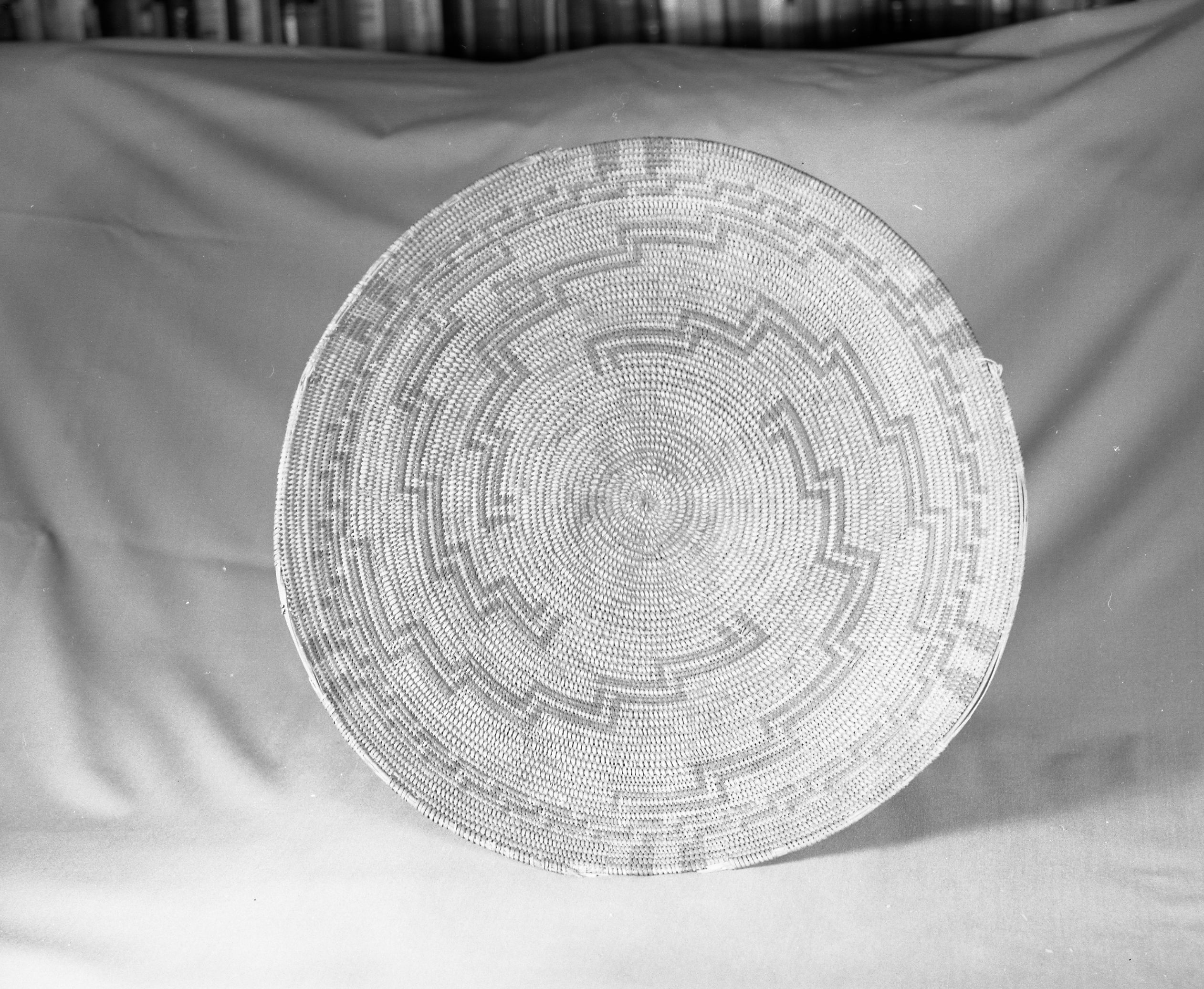 Private Collection. Object: Chumash basket. Dimensions: 16 x 3" (incl. base) Base 3/4" x 5". Materials: Right ward coil direction. Three rod juncus foundation. Technology: Possibly from George Wharton James collection sold by Dawson's Bookstore in Los Angeles, or from a private collection in Newhall. Photographed by Michael Dixon. Catalogued by Craig Bates and Barbara Beroza. Yosemite Collections, National Park Service.