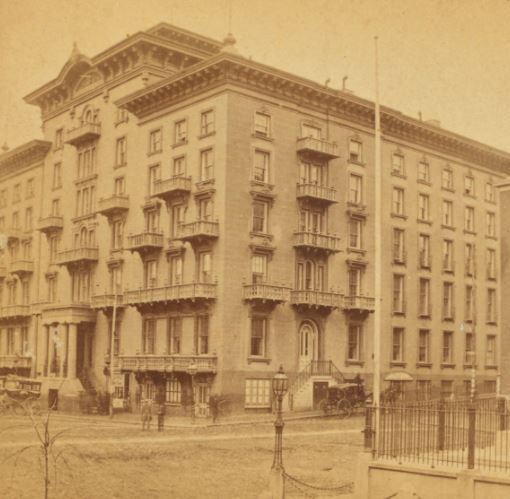 19th century photograph of Barnum Hotel, a multi-story building on a street corner.