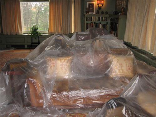 2011 Images of roof leaks and resulting action of covering artifacts in plastic to protect from water damage at Edison's home, Glenmont.
