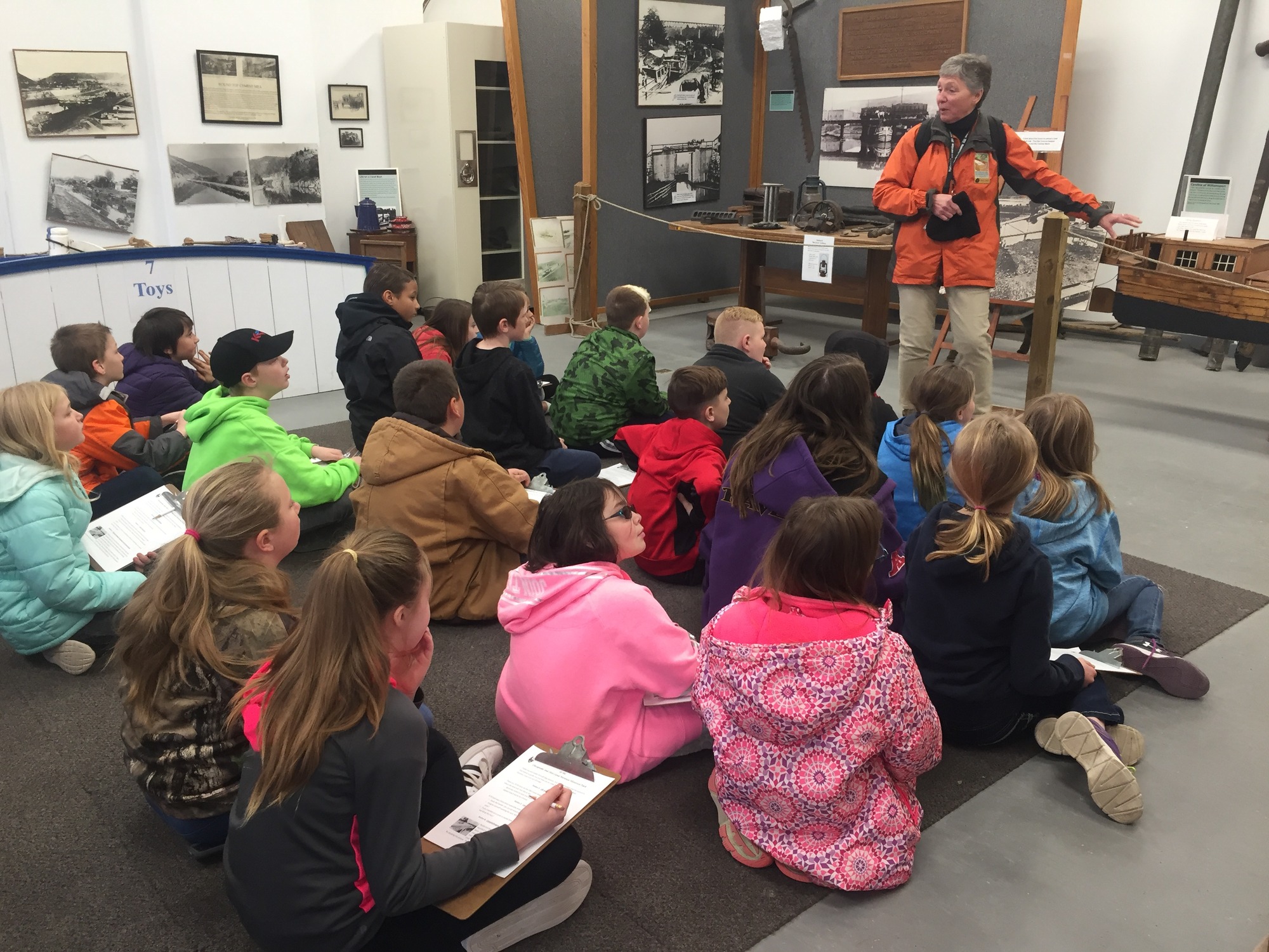 Students seated listening to a CCC teacher talk.