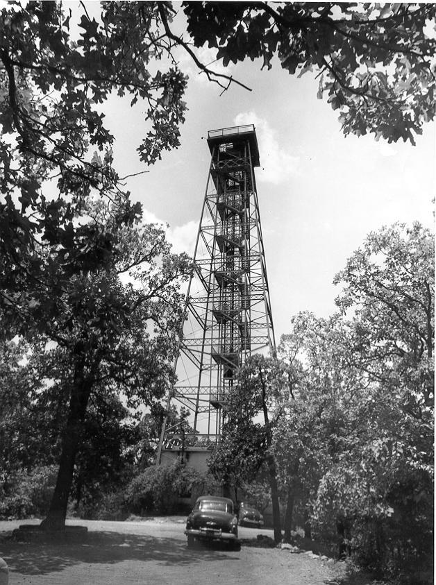 Black & white print; structure
Hot Springs Mountain Observation Tower, informally known as the Rix Tower, 1906-71. The 185-foot steel tower was opened to the public on May 4. An Otis elevator was available, but visitors could also climb the circular staircase of 188 steps to reach the platform on top. During its first year of operation 15,222 passengers walked or rode to its top. Adults paid 25 cents and children under 12 paid 15 cents for the privilege, which resulted in a gross revenue of $3,805.65 during the first year.