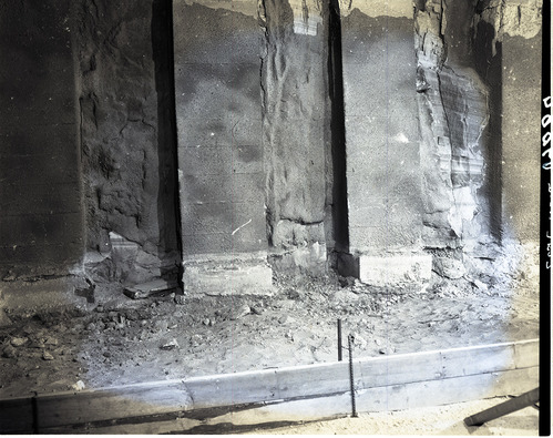 Shattered condition of tunnel wall, illustrating need for repair and danger of work of removing debris from footings.