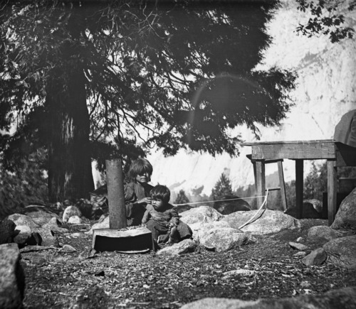 Copy Neg: 1976 by J. Balckburn. Lena using a bowloom for making beadwork.