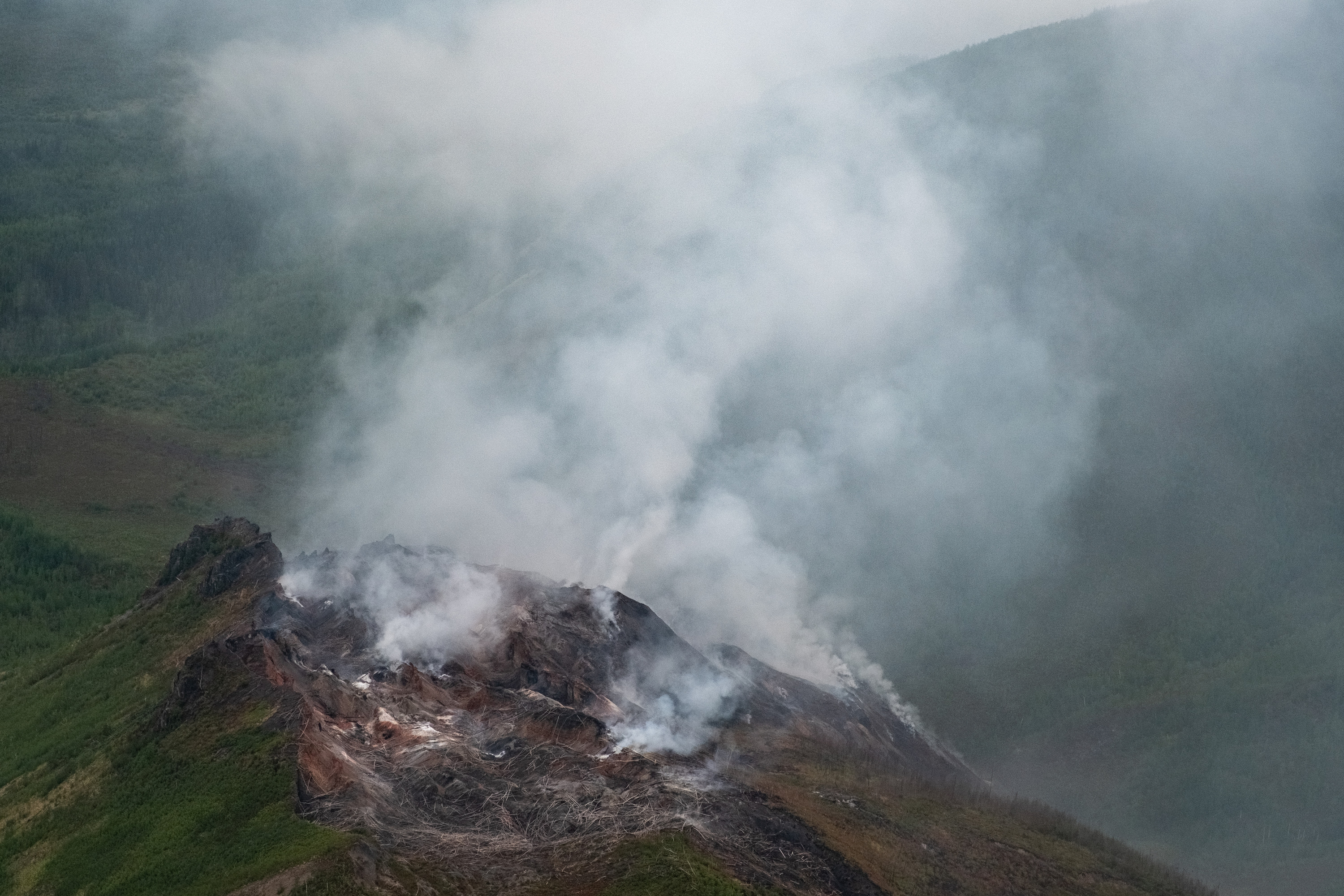 Aerial photo of the Windfall Mountain Fire and low clouds around the ridgetops