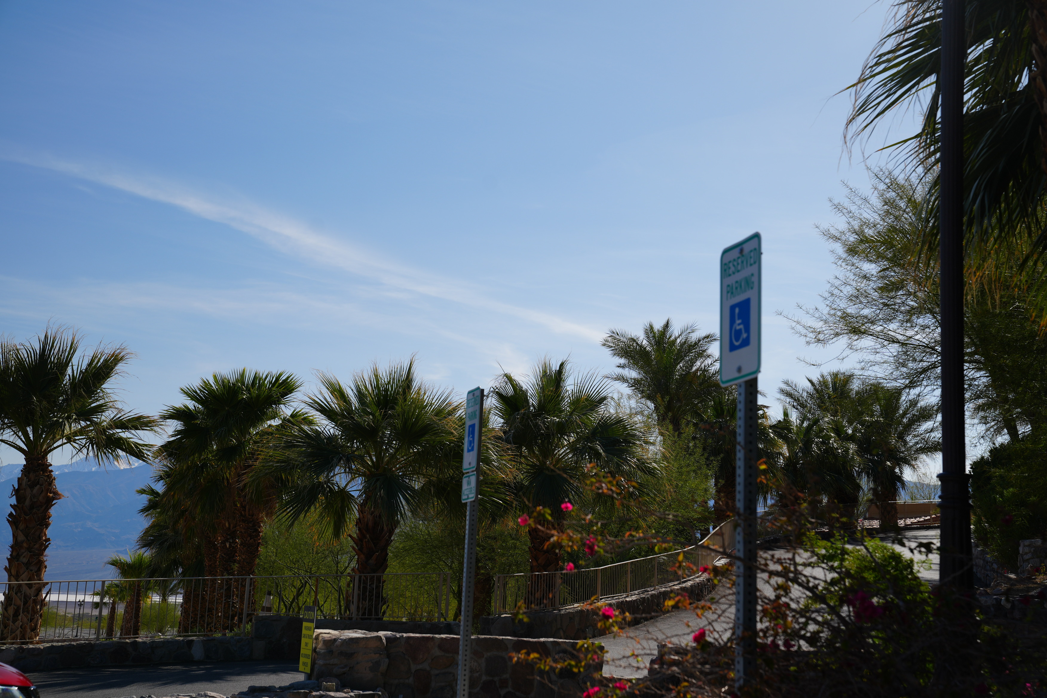 The Inn ADA Parking 2 spots. Two ADA signs next to one another in a parking lot