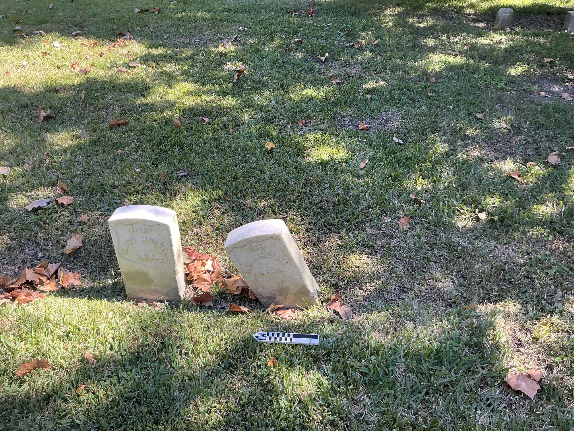 Extra image of historic upright marble headstone with recessed shield face.