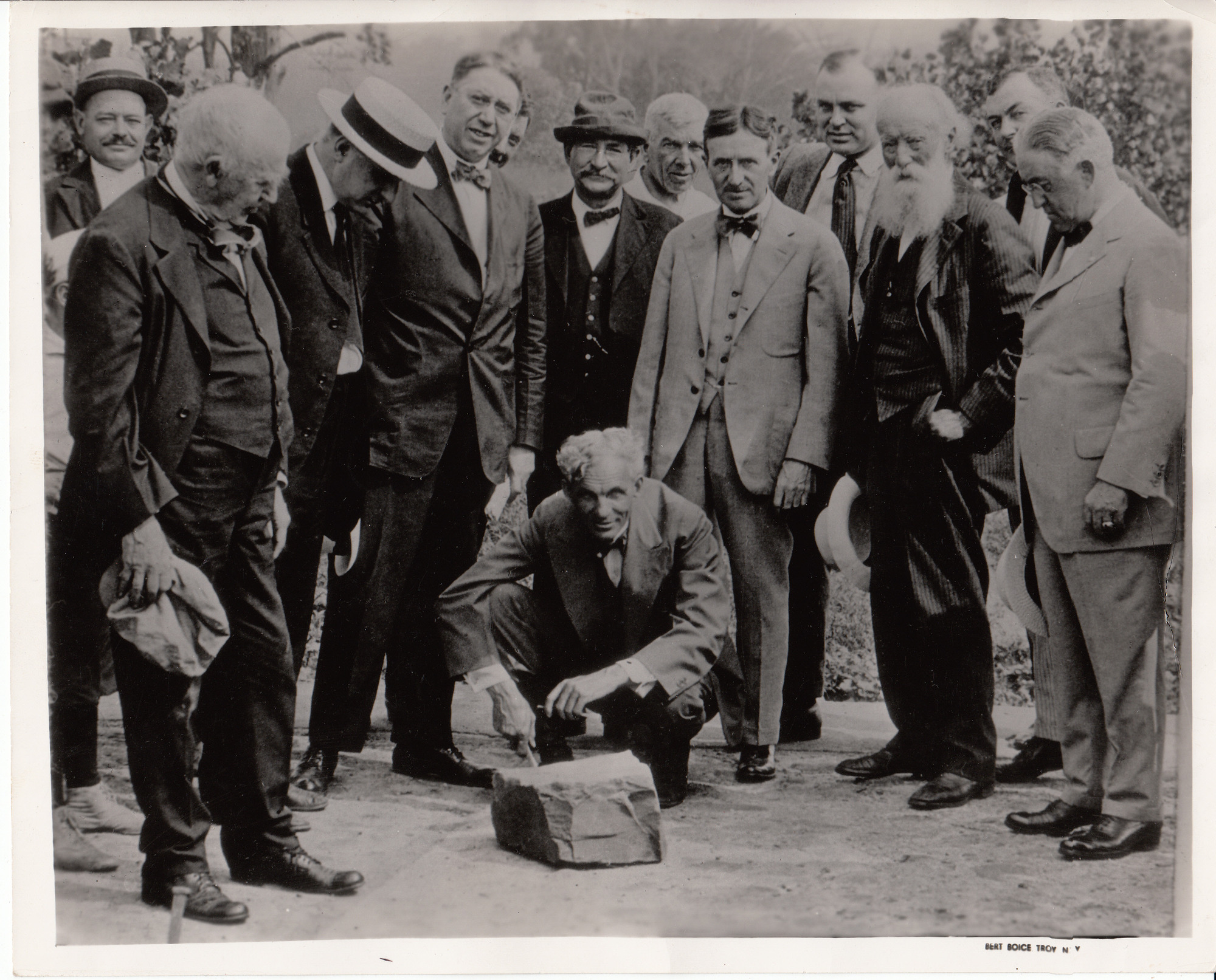 Thomas Edison, Cornelius Burns, James R. Watt (Mayor of Albany), Mayor of Troy, Henry Ford, Harvey S. Firestone, John Burroughs, and others examining a block of sandstone.