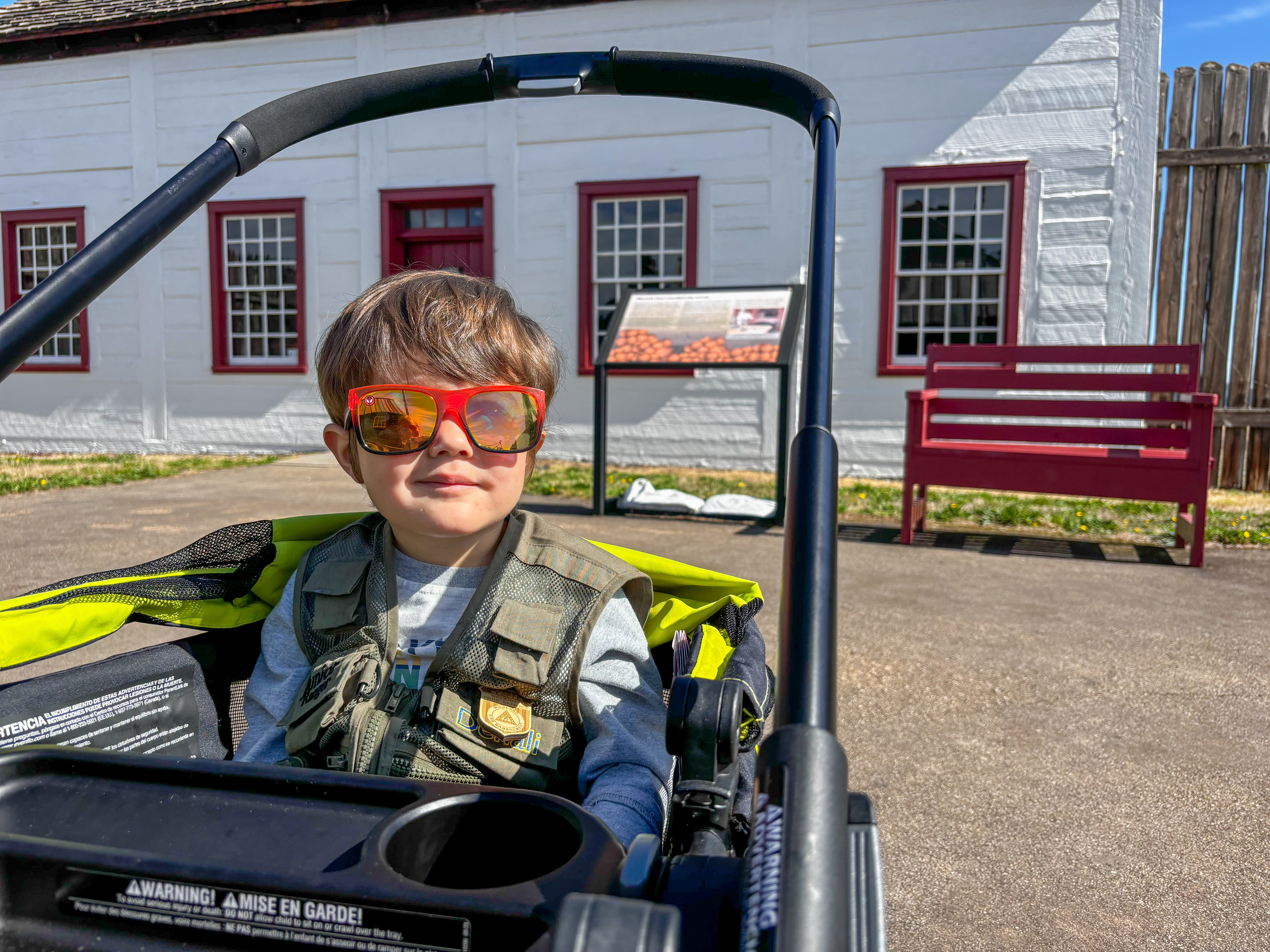 A child sits in a stroller. 