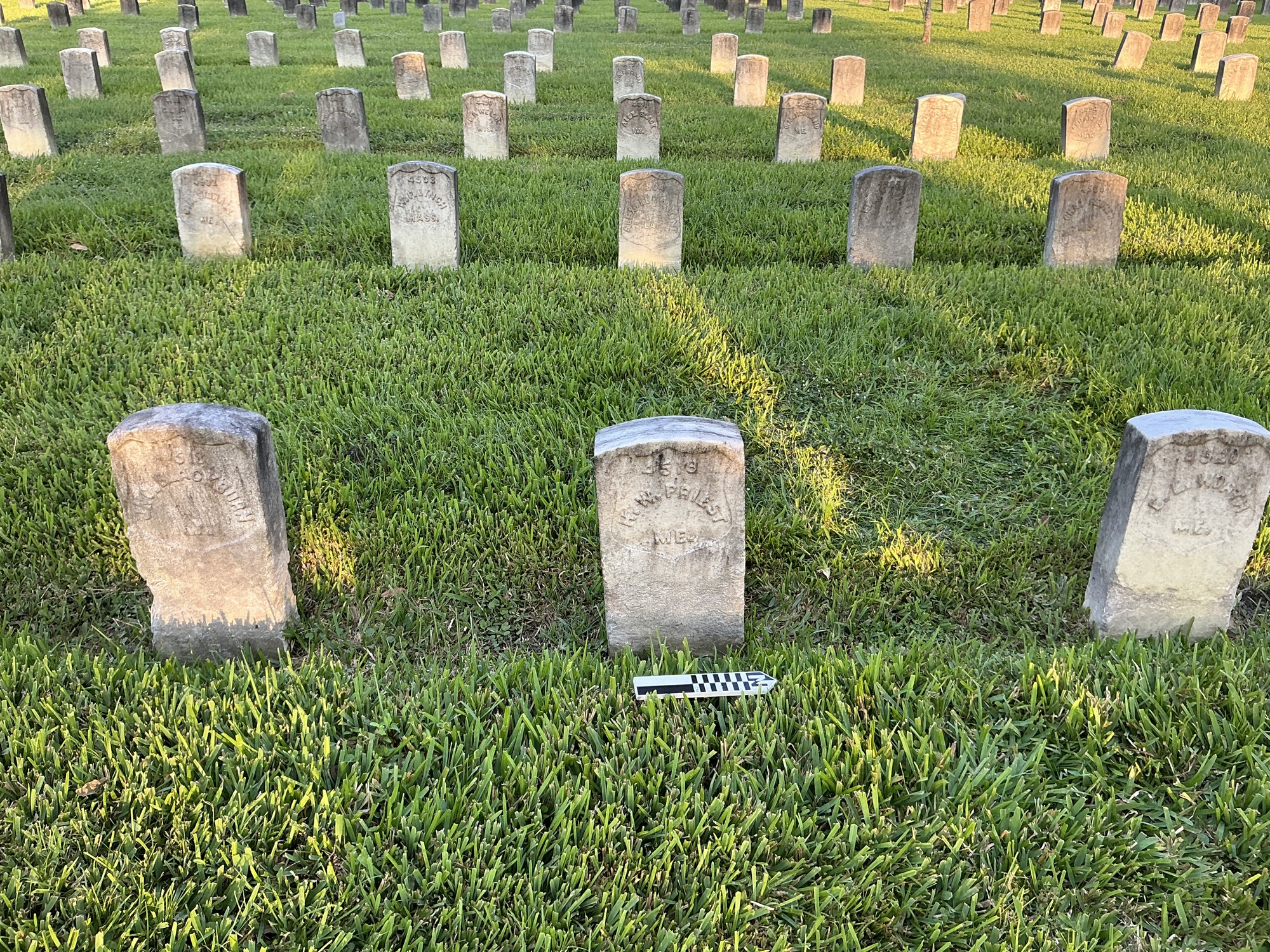 Extra image of historic upright marble headstone with recessed shield face.