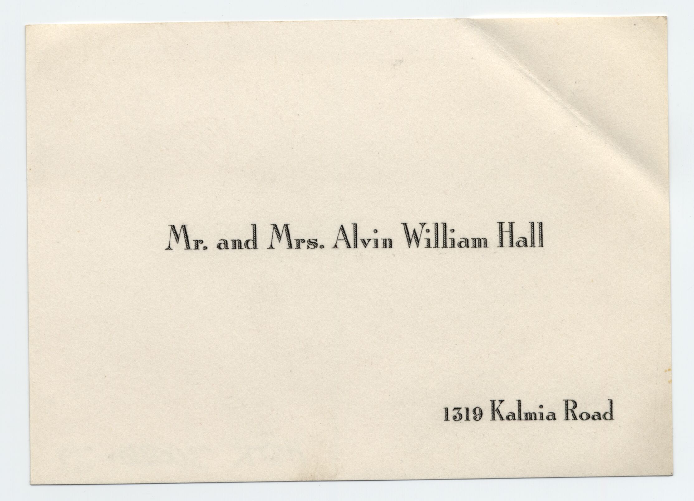 A small calling card with the visitor's name printed in the center.