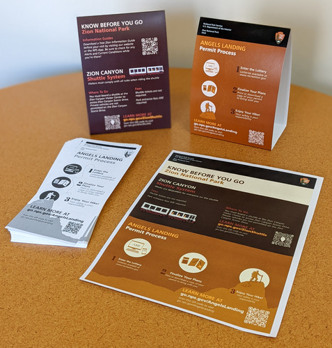 Four printed products showing information about how to plan visits to Zion National Park.