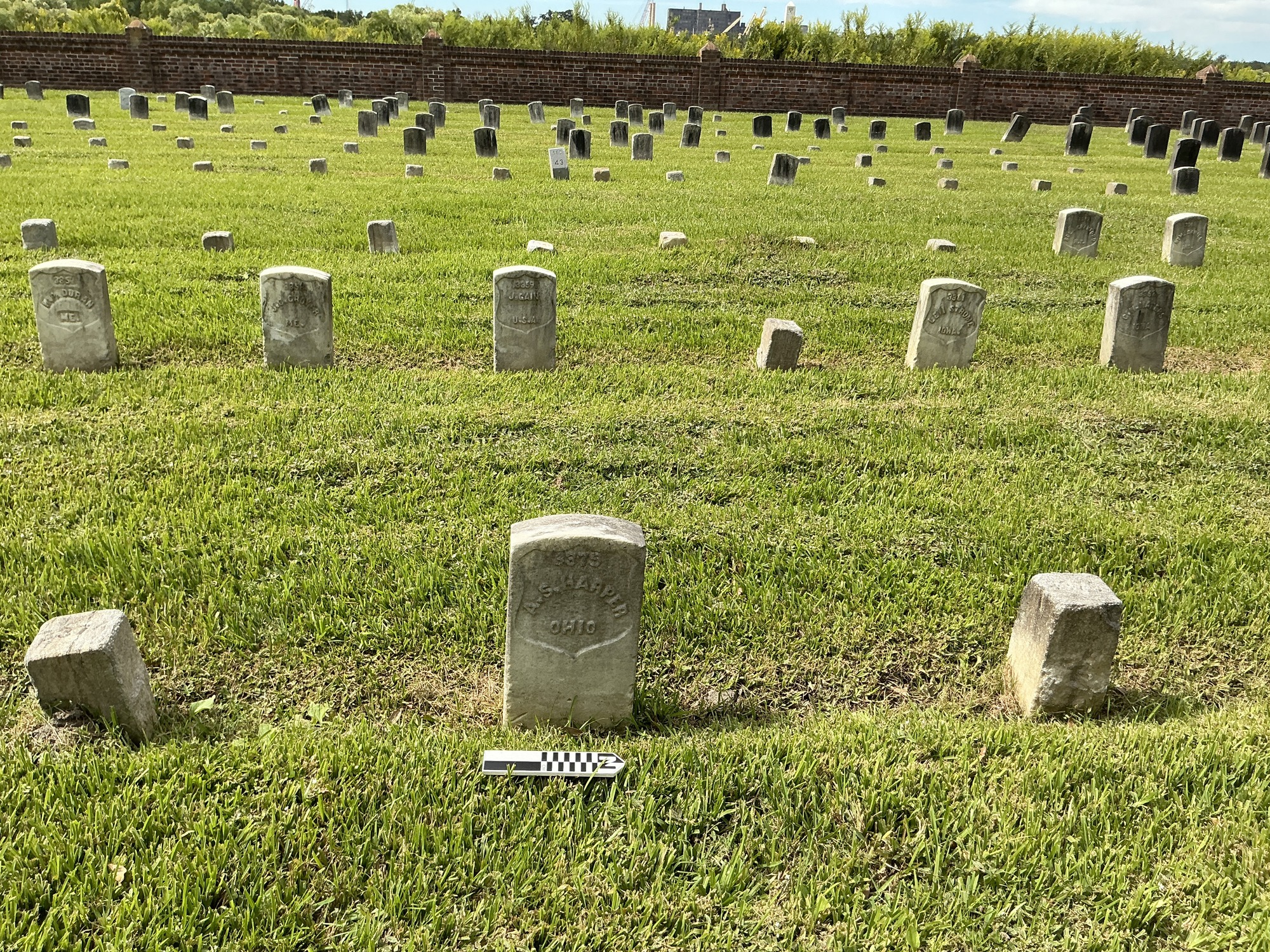 Extra image of historic upright marble headstone with recessed shield face.