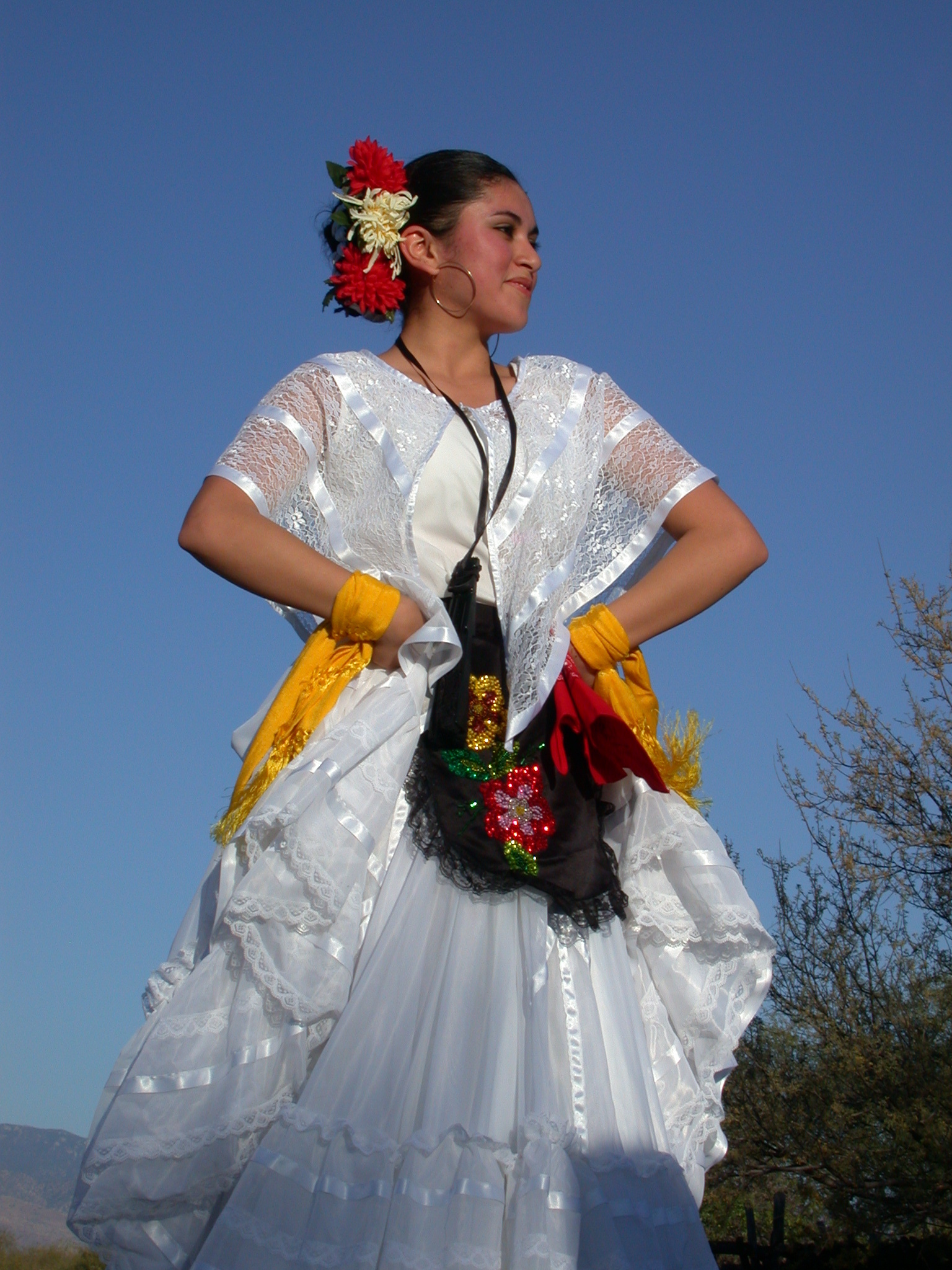 Folklórico dancers at La Fiesta de Tumacácori, woman in traditional dress and headpiece