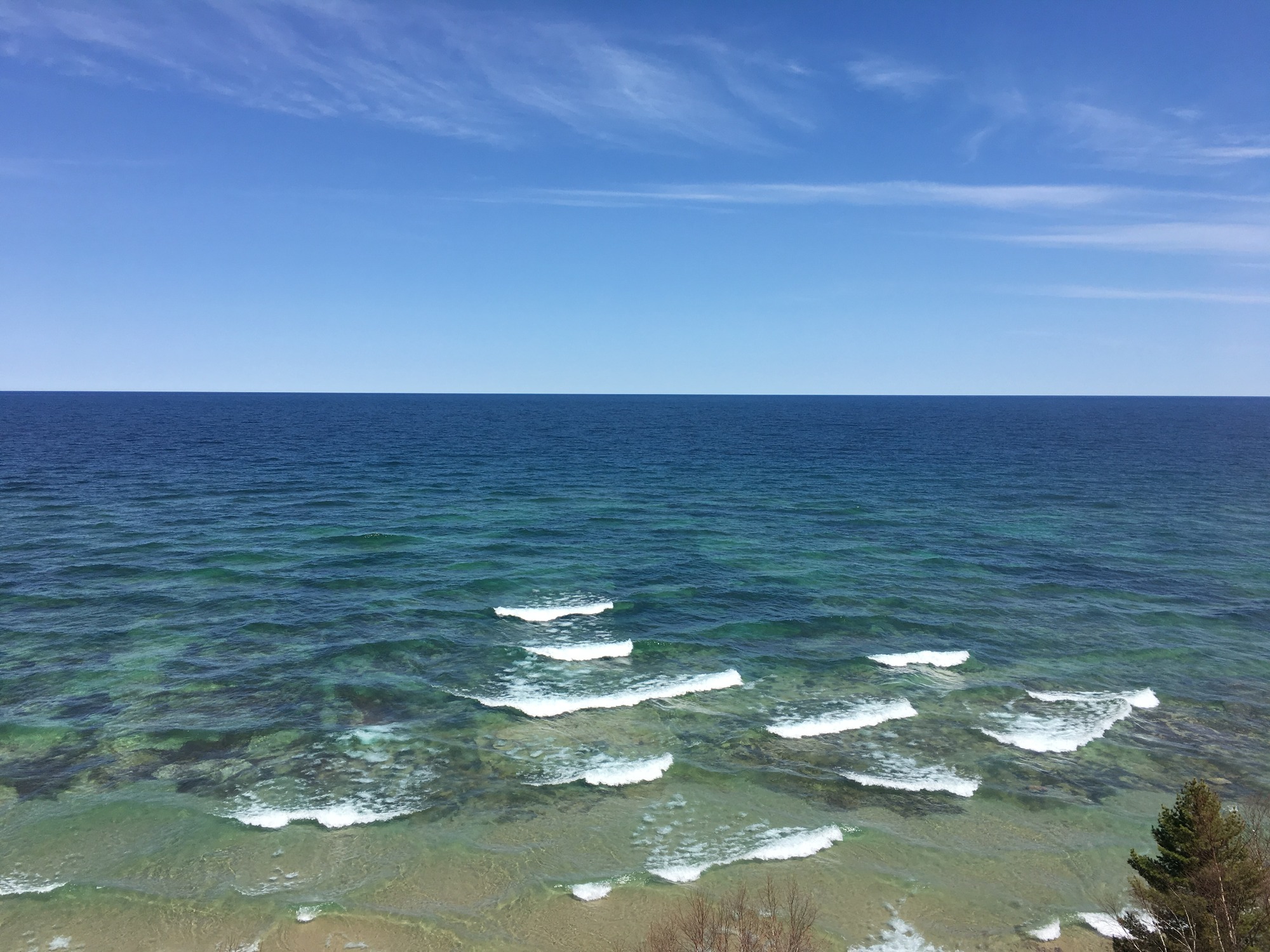 Shallow water and rocks visible underwater in Lake Superior. 