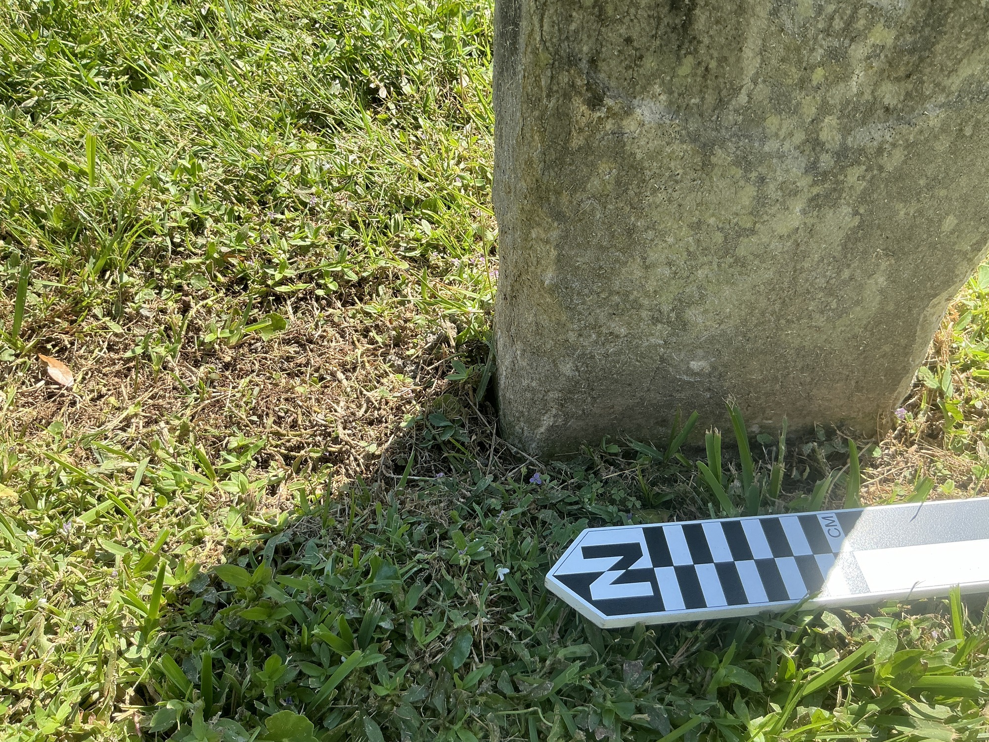 Extra image of historic upright marble headstone with recessed shield face.