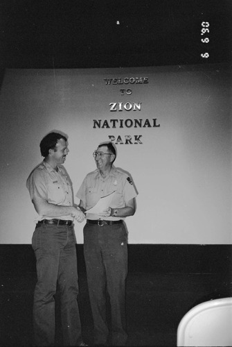 BW Photos of Superintendent Harold Grafe giving out awards to park personnel.