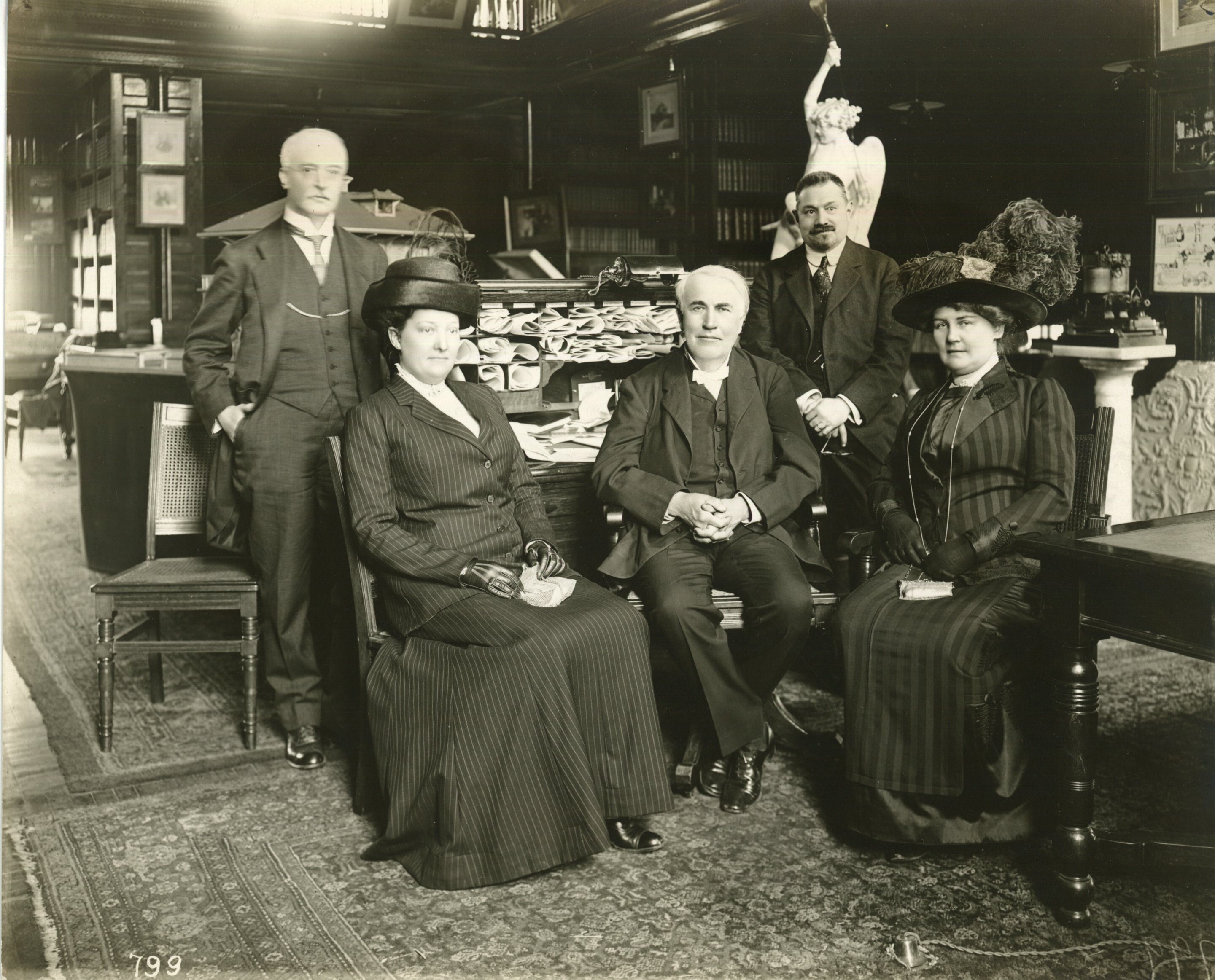 Thomas Edison in the laboratory Library with (from left), Dr. Rudolf Diesel, Mrs. Calvin W. Rice, J.W. Lieb Jr., Mrs. Diesel.