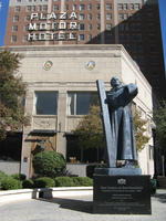 A statue in front of a building.