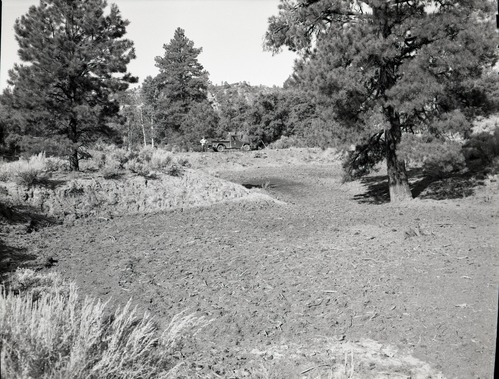 Illegally constructed water reservoir on government property.