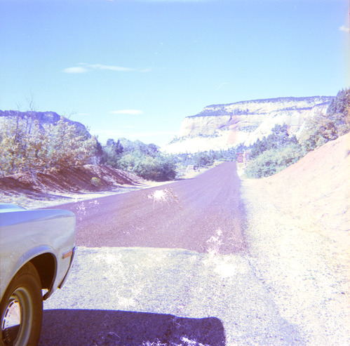 Road after chipsealing and Zion landscape in the background.