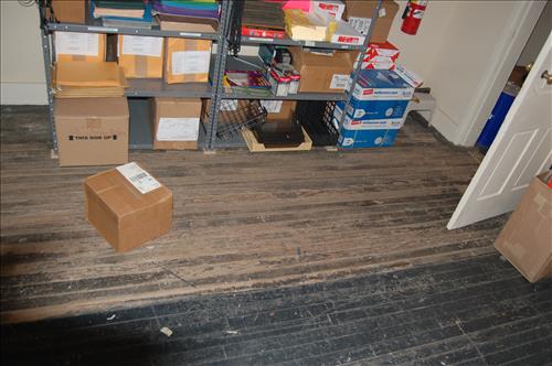 Water infiltration and damage to walls and floor of the Petersen House