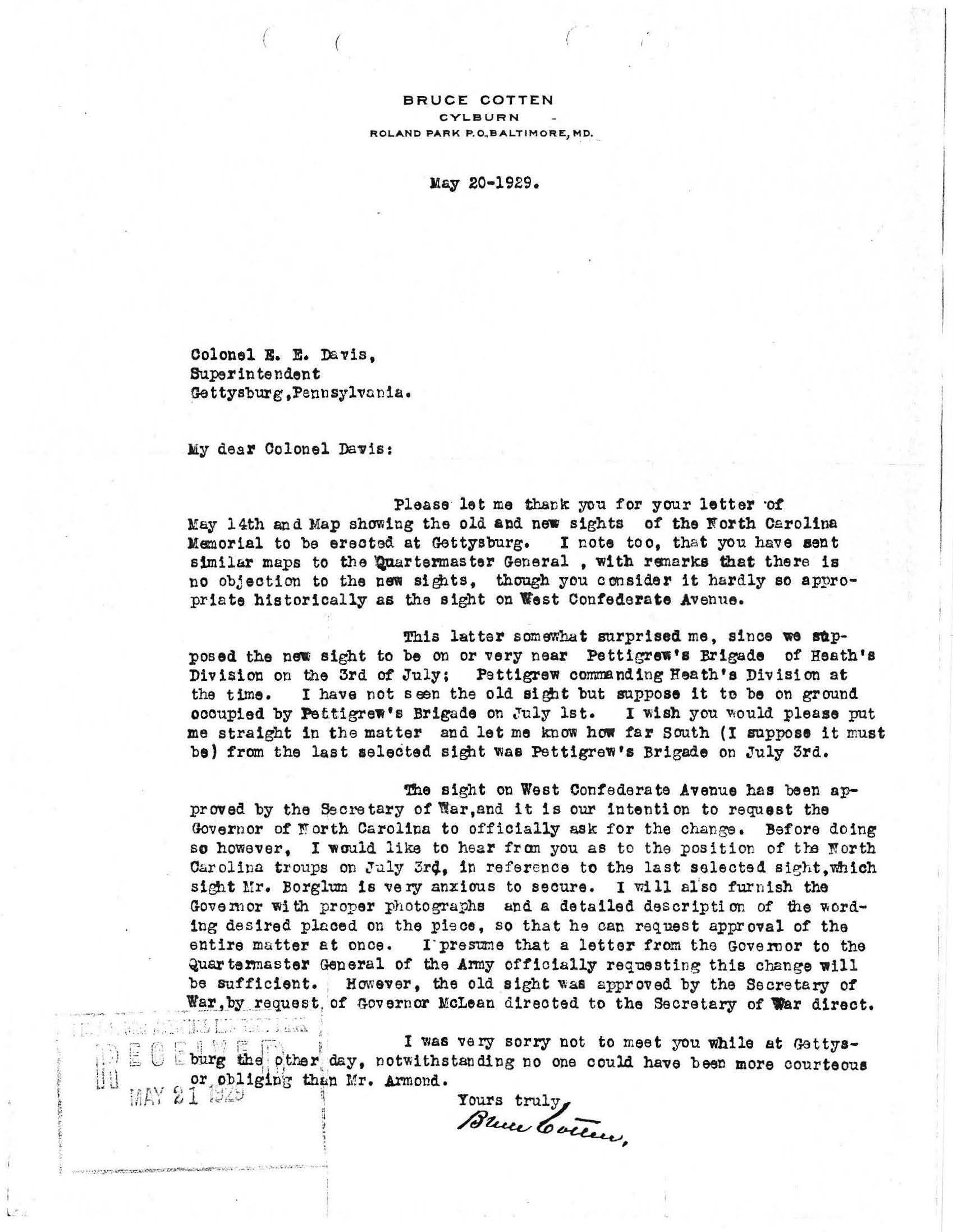 White paper with typed black text and a handwritten signature