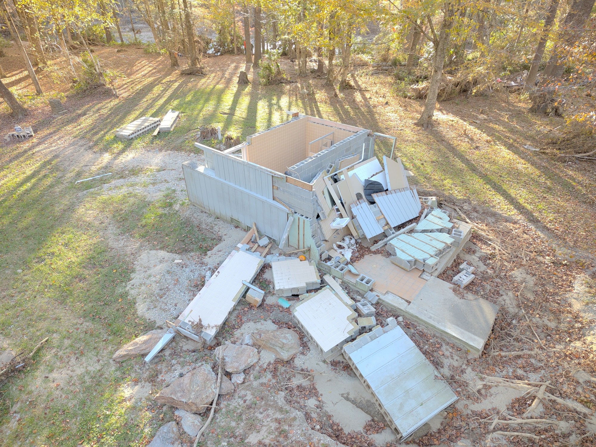 Hurricane Helene destroyed the comfort station at Linville Falls with sections of the building scattered across the ground. 