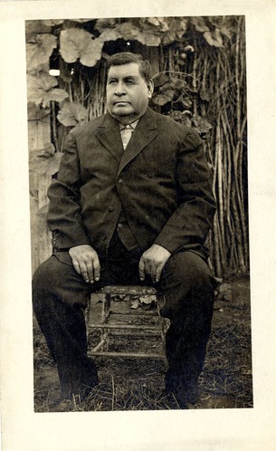 George Bent in a Civilian Suit Sitting Outside