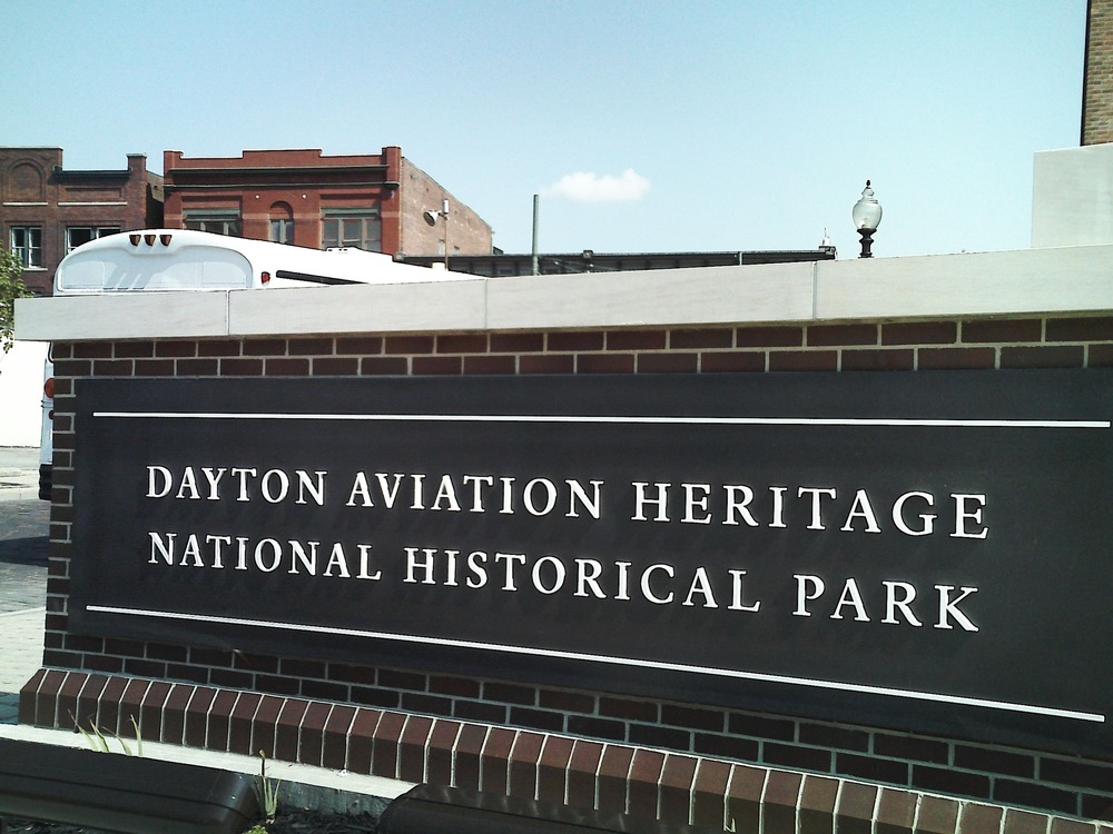 YMCA kids photograph park sign