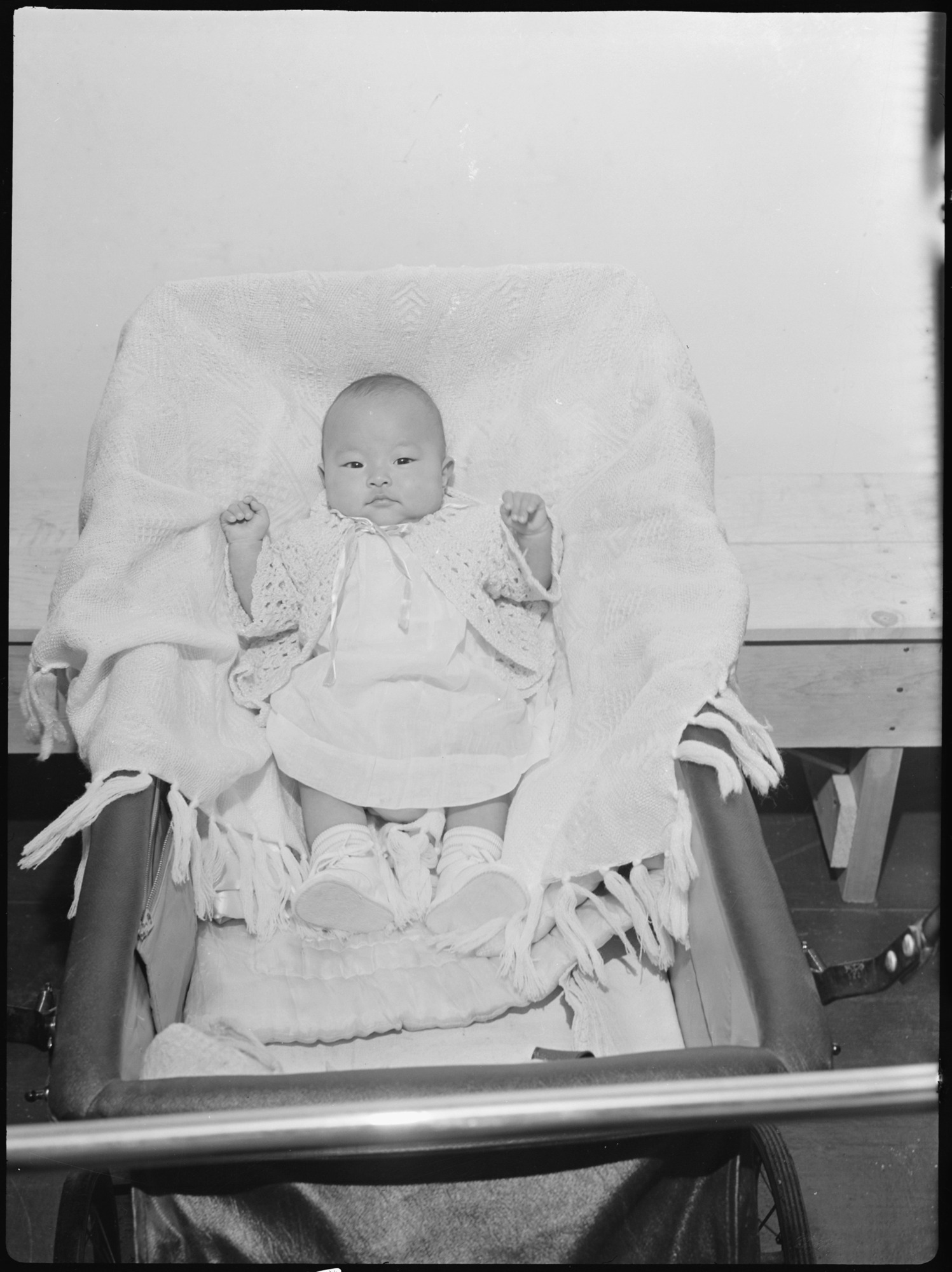 This picture of an evacuee child was taken for evacuee use. This picture is interesting from a documentary angle, however, for it shows the doll-like features of the Japanese children