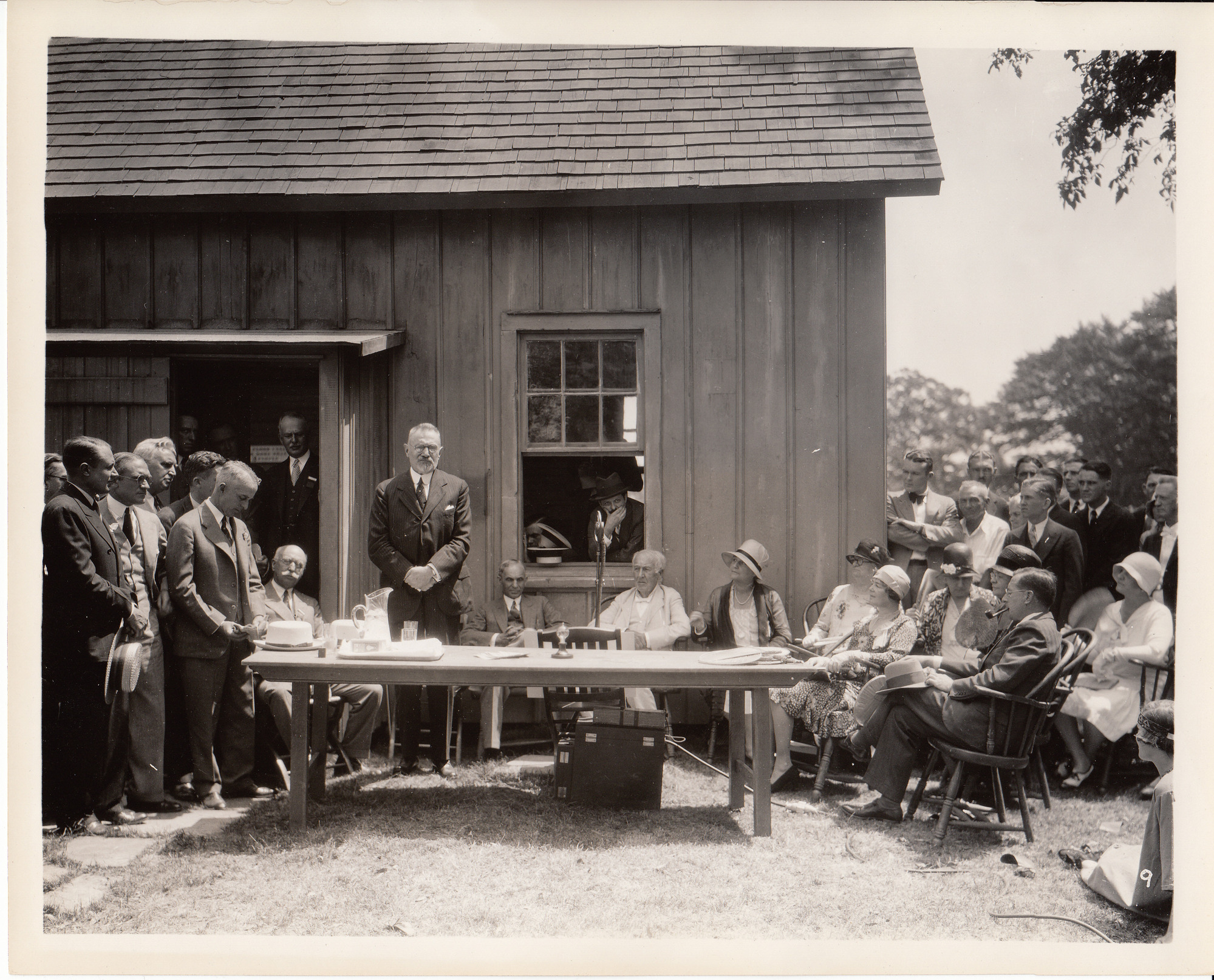 Presentation of Glass House to Henry Ford, left to right, John W. Lieb, Henry Ford, Thomas Edison, Mina Edison, Anna Edison with fan.