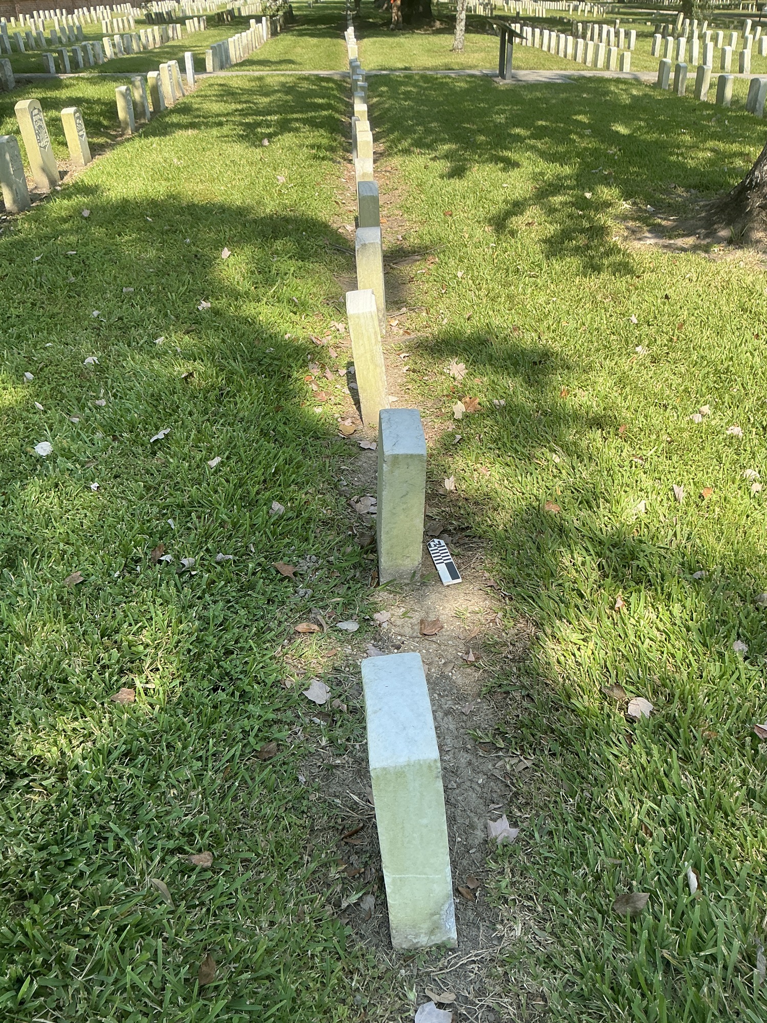 Extra image of historic upright marble headstone with recessed shield face.