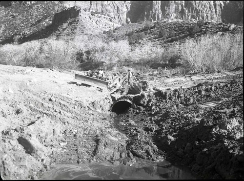 Uncovering 50' half culvert disposal galleries, South Entrance sewage disposal field.