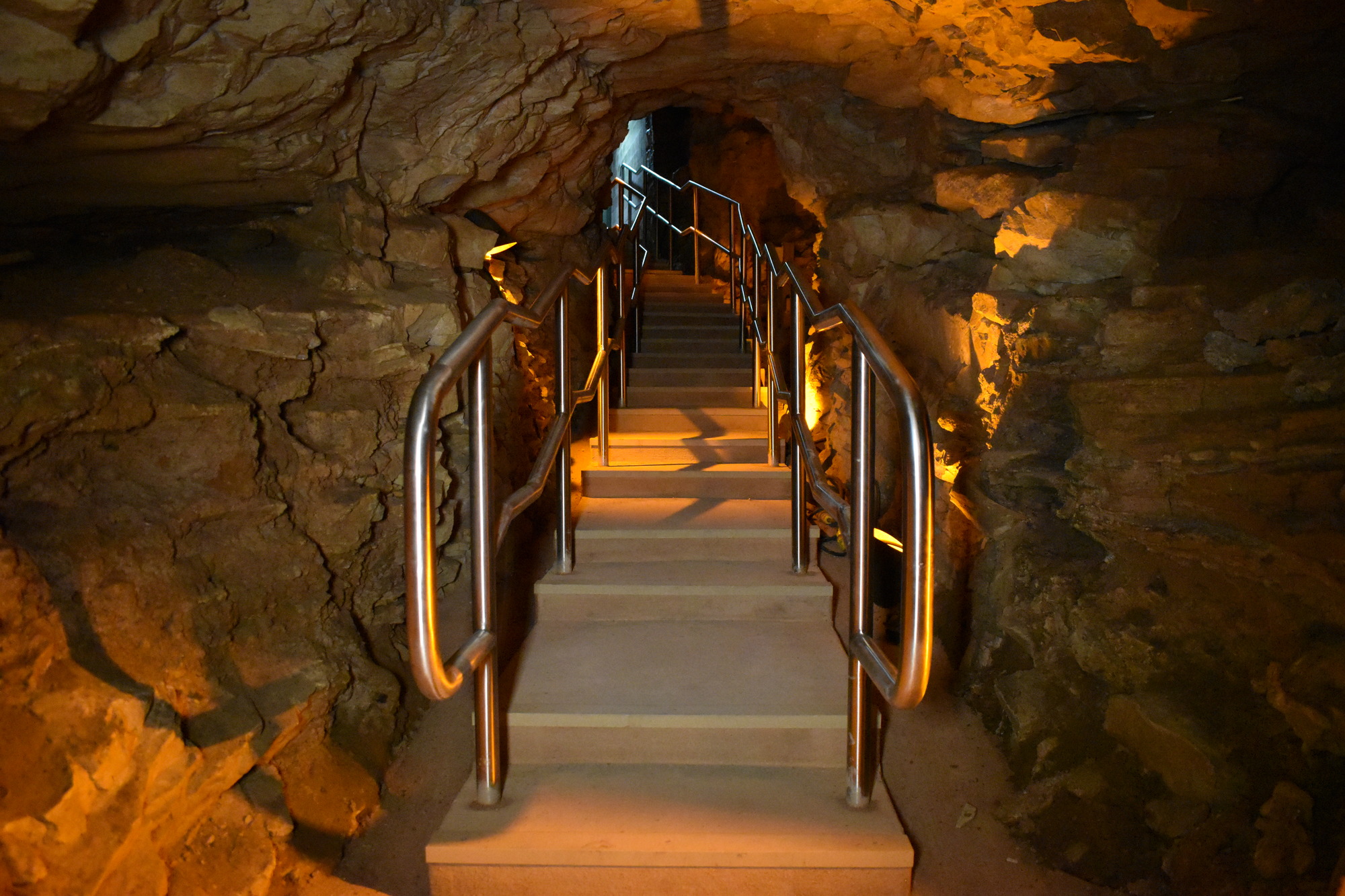 A short staircase lined with handrails. 
