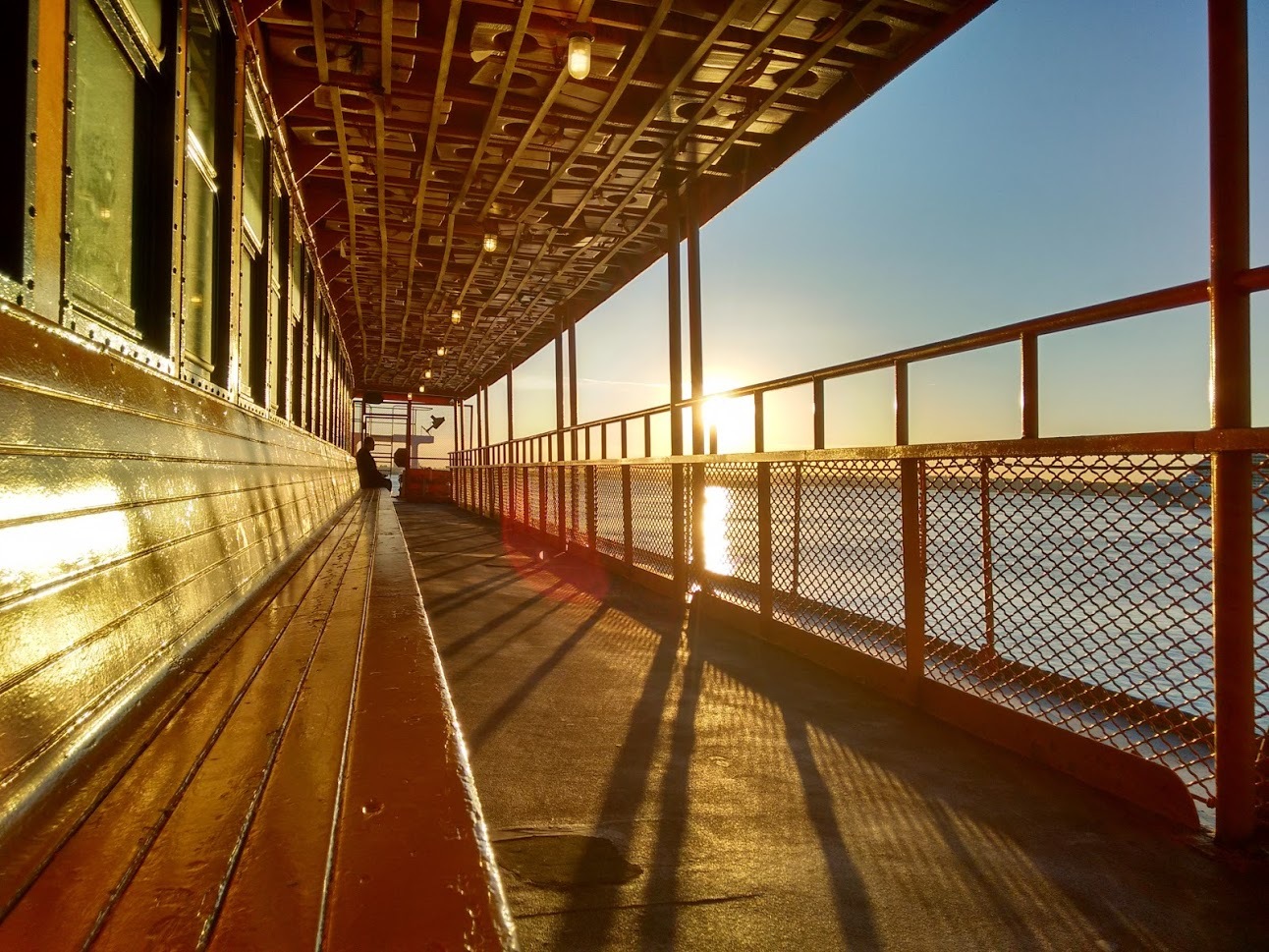 solo rider on ferry, near Governors Island